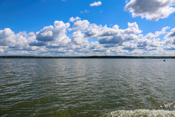Beautiful natural summer landscape with picturesque lake Senezh and cloudy sky. Moscow region, Russia