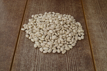 White kidney beans isolated on wooden background with copy space for your text.