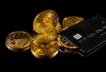 Golden coin with bitcoin logo and credit card . Leader in cryptocurrency BTC and bitcoin rewards...