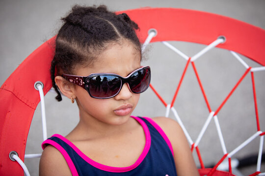 Young girl in sunglasses  pouting