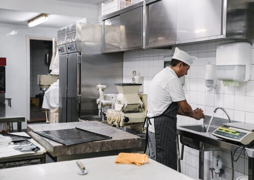 Middle Age Man Working At Bakery