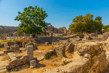 SIDE, TURKEY: Ancient ruins in the city of Side on a sunny summer day against the background of the blue sky.