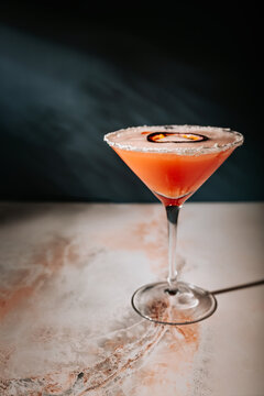 Orange cocktail in a martini glass