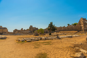 SIDE, TURKEY: Ancient ruins in the city of Side on a sunny summer day against the background of the blue sky.