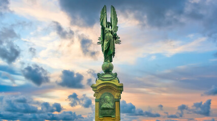 Fototapeta premium Brighton and Hove, Sussex, UK - January 2019: Peace Statue in Brighton and Hove during sunset under dramatic clouds