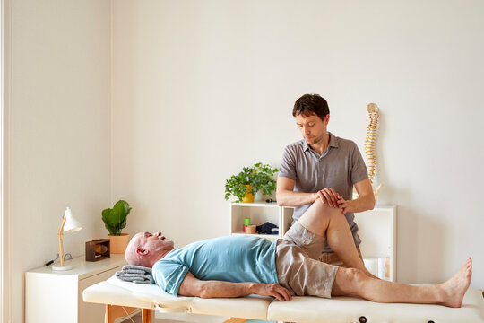 A senior patient and an osteopath