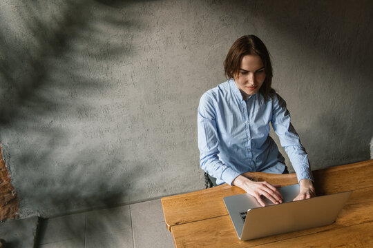 Woman Using Computer Indoors