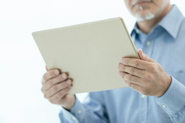 Businessman holding a tablet-pc in his hands