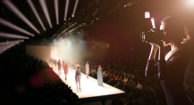 Photographer Press Woman Use Camera To Shoots Photo Of Fashion Week Show Which Model Supermodel Walk On Runway Catwalk For New Collection Of Designer Brand, Background Copy Space