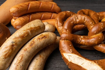 pretzels and sausages on oktoberfest table