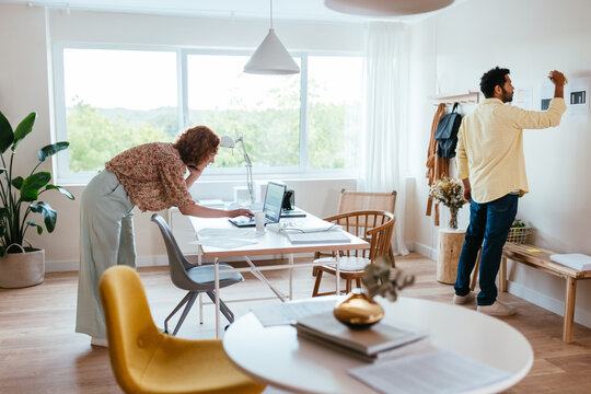 Diverse colleagues working in light workplace