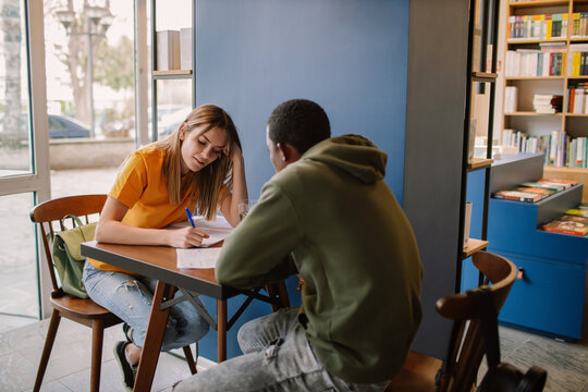 Two Young Students In Cafeteria