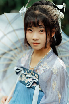 Asian teenage girl wearing traditional Chinese Hanfu costume