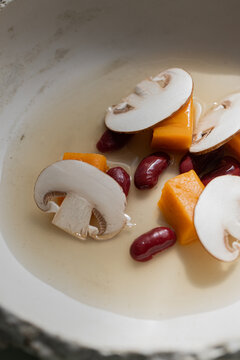 Food: Consome of Ceps, pumpkin gnochi and black beans