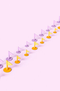 Purple and yellow plastic flags crossing the frame