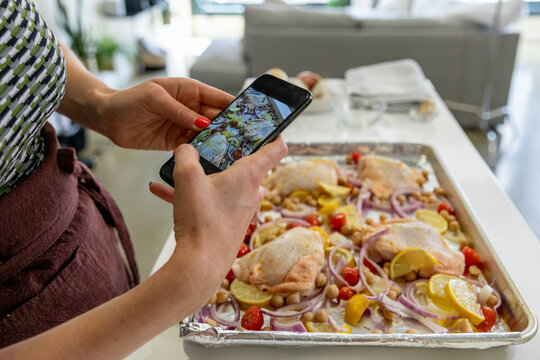 Woman Takes Phone Picture of Prepped Chicken