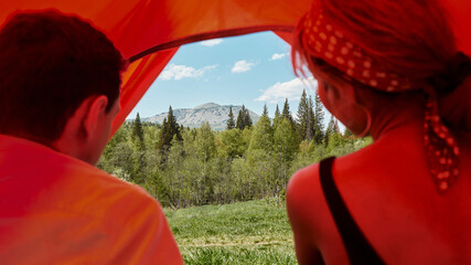 Man And Woman Sitting In Tent