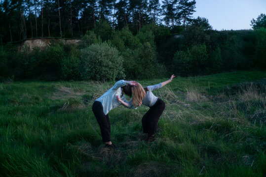 two women contemporary dancers dancing at dawn