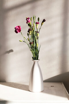 flowers bouquet on a vintage bedside table