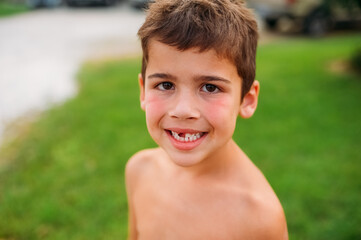 Child with a messy face smiling. 