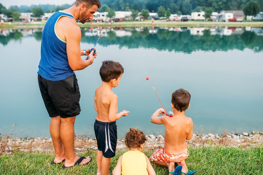 Father bonding with his kids while fishing. 