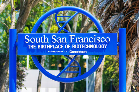 South San Francisco the birthplace of biotechnology sign. The sign has a simple 3-D model of a DNA spiral winding through the landmark sign - South San Francisco, California, USA - 2021