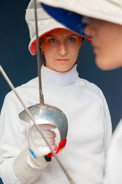 Female fencer preparing to fight opponent