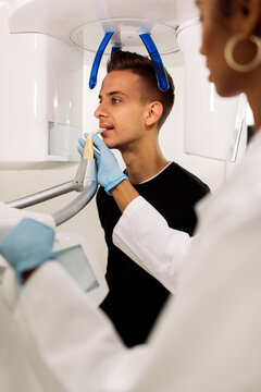 Man doing a x-ray exam in dentist