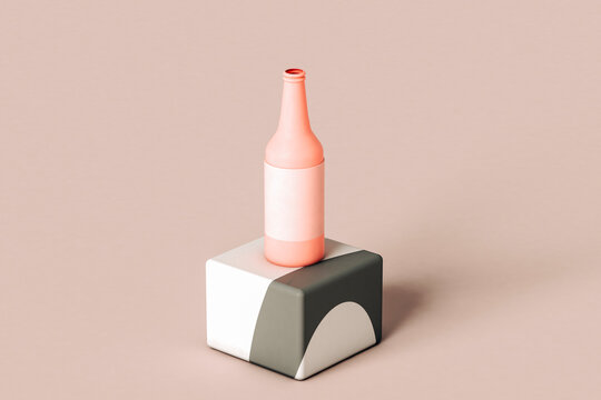 Pink beer bottle on a grey cube