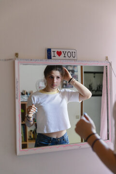 Girl looking in the mirror