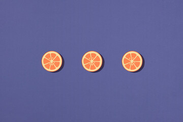Three orange fruit ring slice make from paper
