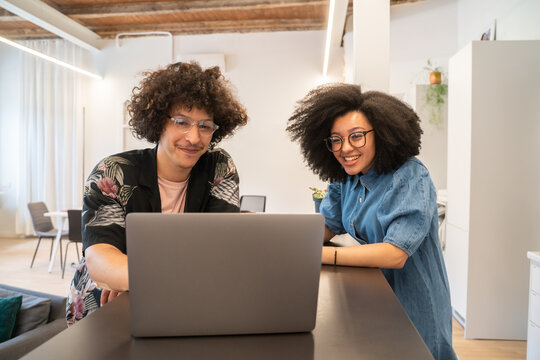 Man And Woman Attending Video Conference