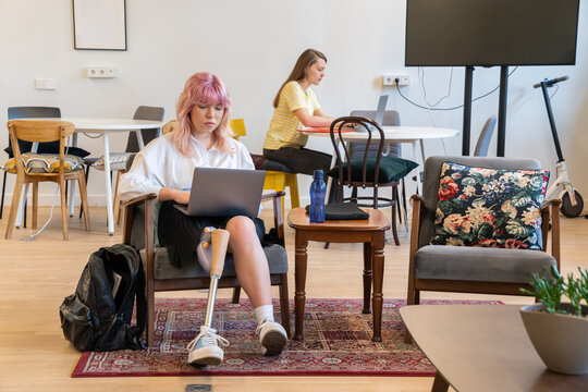 People Working With Laptop At Co-working Space.