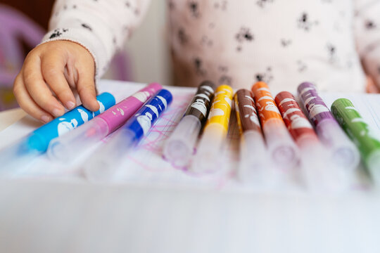 A Girl Counts Some Pencils