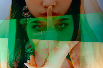 fashion girl making keep quiet gesture