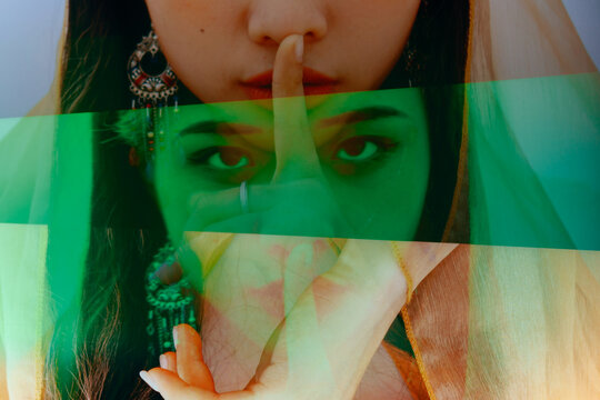 fashion girl making keep quiet gesture