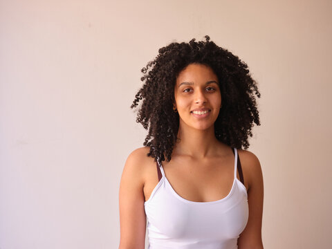 Natural smiling black woman looking at camera