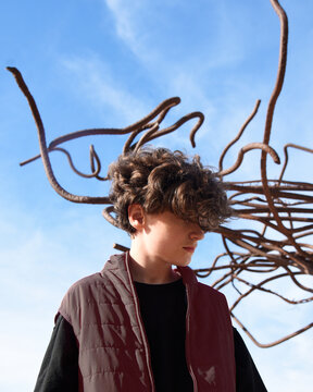 Conceptual Boy Standing Alone with Wires