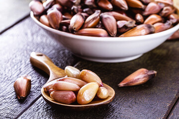 spoon with boiled pine nuts or cooked pinhão seeds, a typical culinary ingredient from southern Brazil