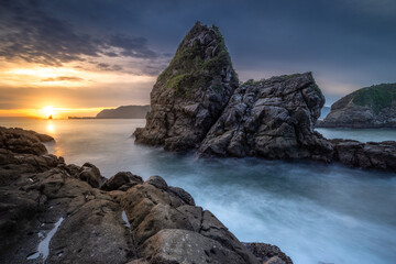 sunset on the rocky coastline