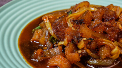 Stir fry cow skin with spicy soy sauce.