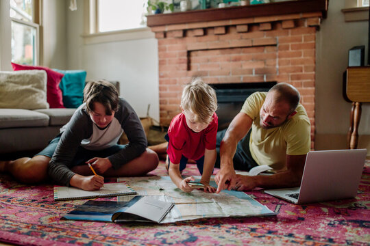 Dad and boys planning trip