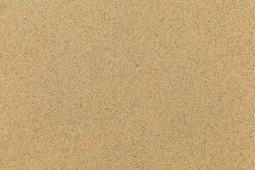 Fototapeta na wymiar Clean brown fine sand for use as a background