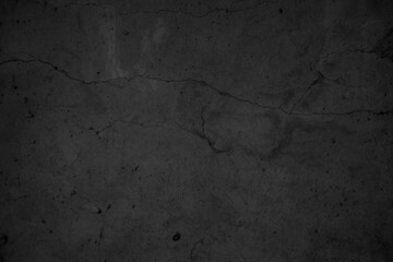 Art black concrete stone texture for background in black. Abstract color dry scratched surface wall grey dark detail covering.