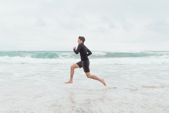 Young runner at the beach