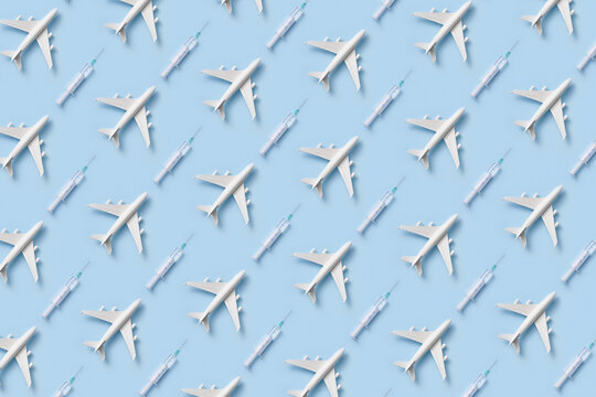 Pattern of white toy planes and syringes