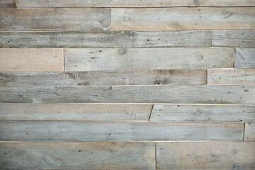 Wall is made of real old wooden boards, horizontally attached unpainted