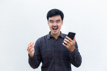 man using mobile, cell phone.young male person.posing smiling laughing look excited surprised thinking positive happy.empty,copy space for text advertising.white background