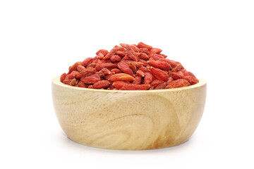 Goji berry in wooden bowl isolated on white background. Goji berry, or wolfberry. Used in...