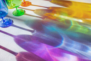Colourful drinking glasses in summer sunshine